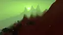 Dark mountains loom over the cursed landscape of the wastelands